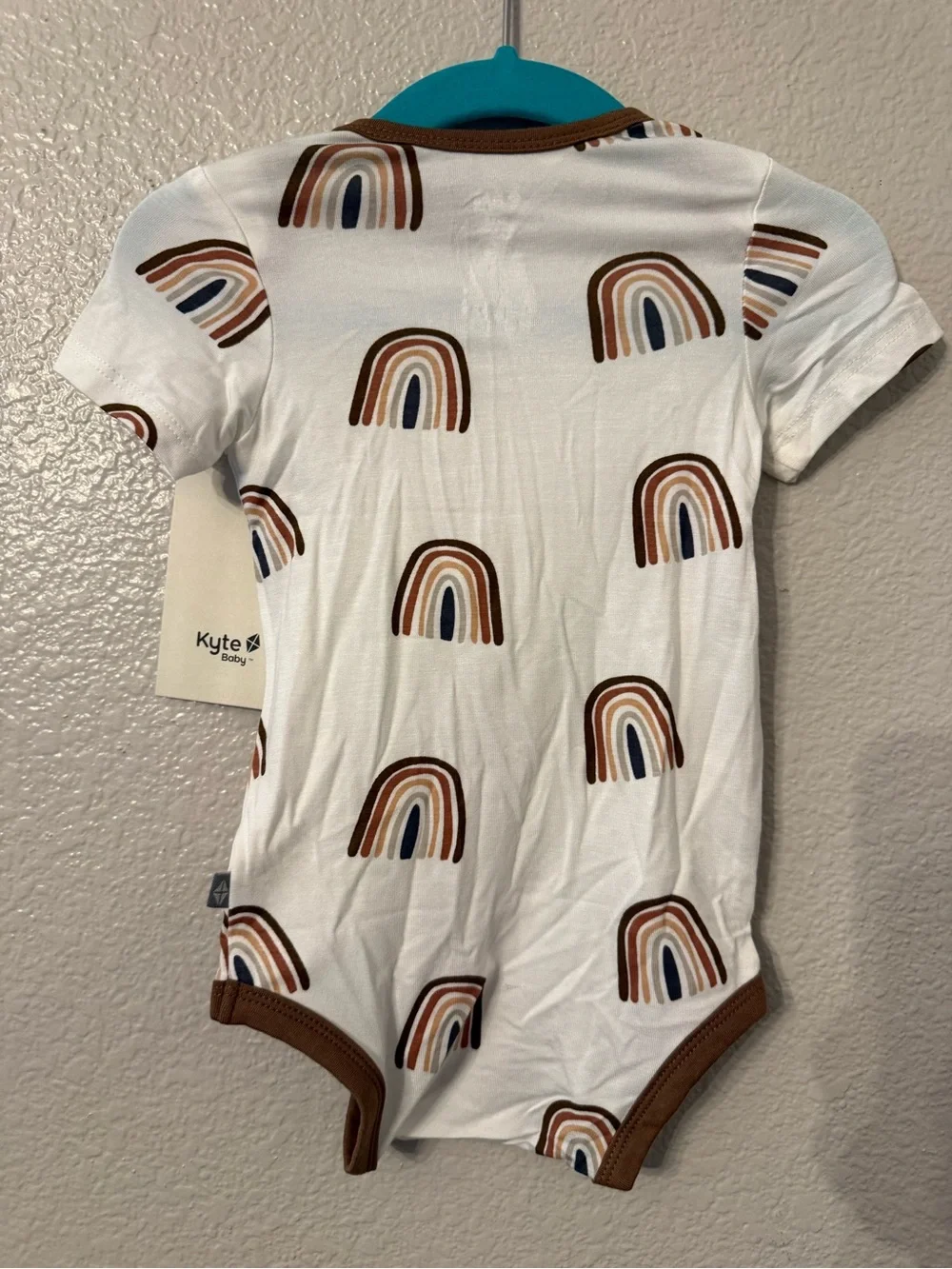 Kyte BABY Cream One-Piece with Brown Trim and Rainbow Print